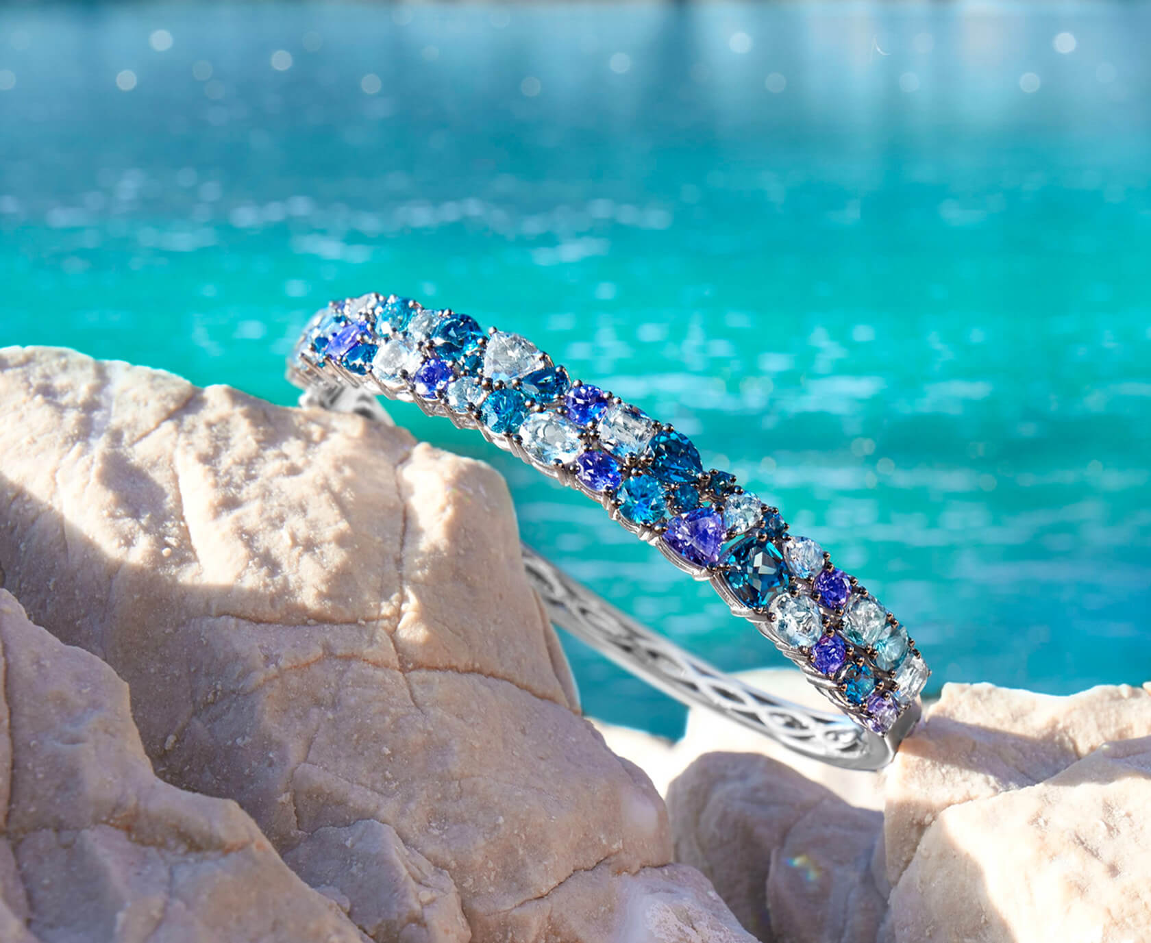 Le Vian® Bangle featuring 2 1/2 cts. Deep Sea Blue Topaz™, 3 1/2 cts. Sea Blue Aquamarine®, 1 7/8 cts. Blueberry Tanzanite®, 1 1/5 cts. Blueberry Zircon™, set in 14K Vanilla Gold®